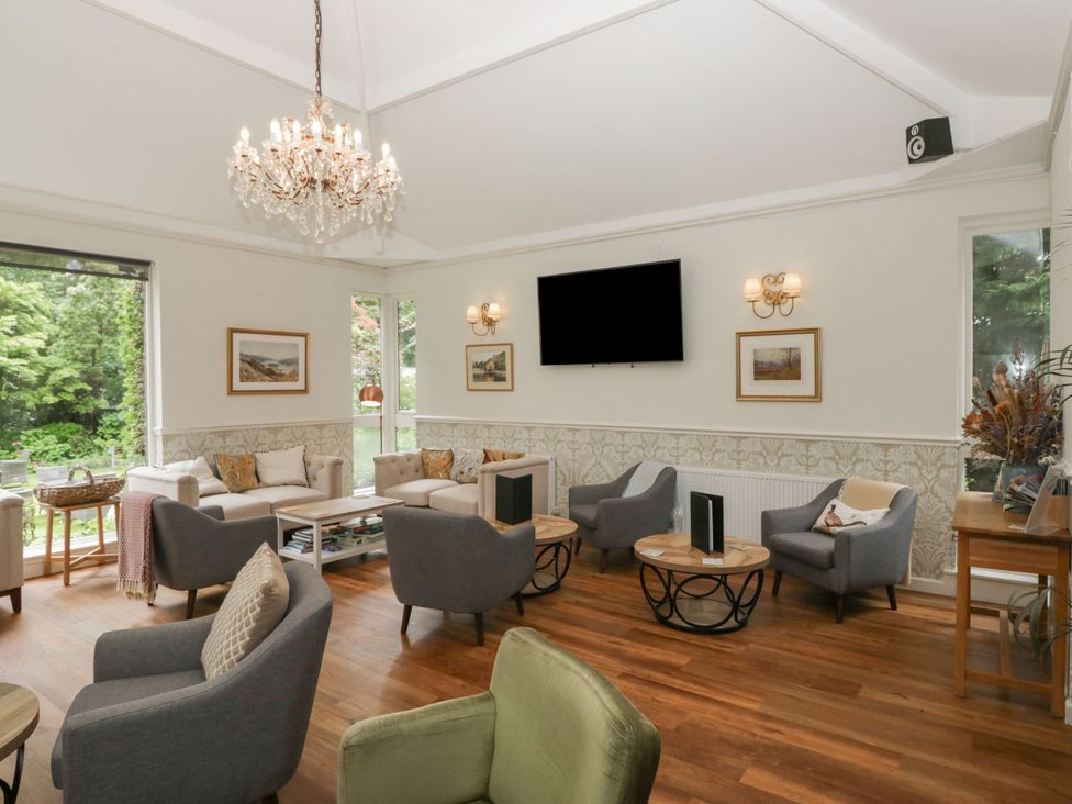 A living room with sofas and a television at Coleridge in Ambleside