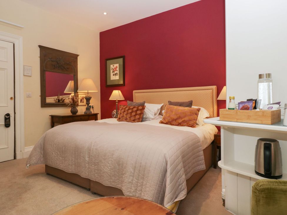 A bedroom with a bed and lamp at Dorothy in Ambleside