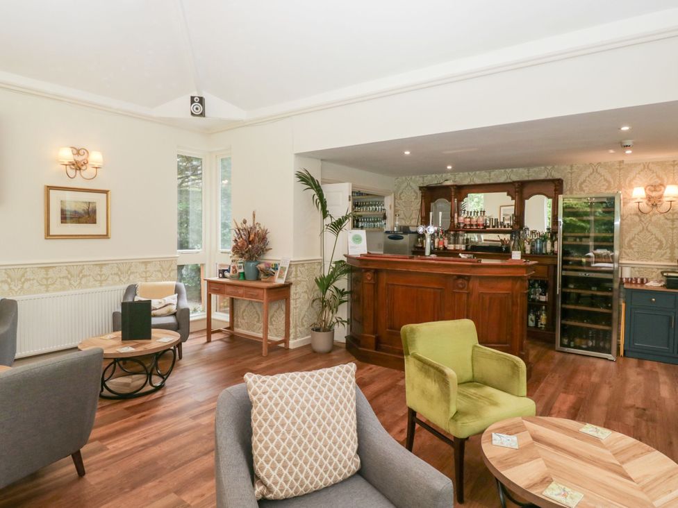 A snug with a bar and seating area at Dorothy in Ambleside