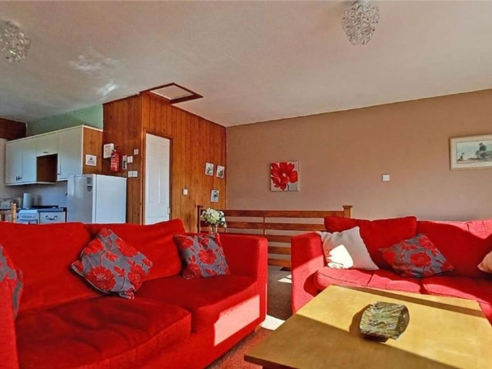A living room with sofas and a coffee table at The Old Barn in Manchester