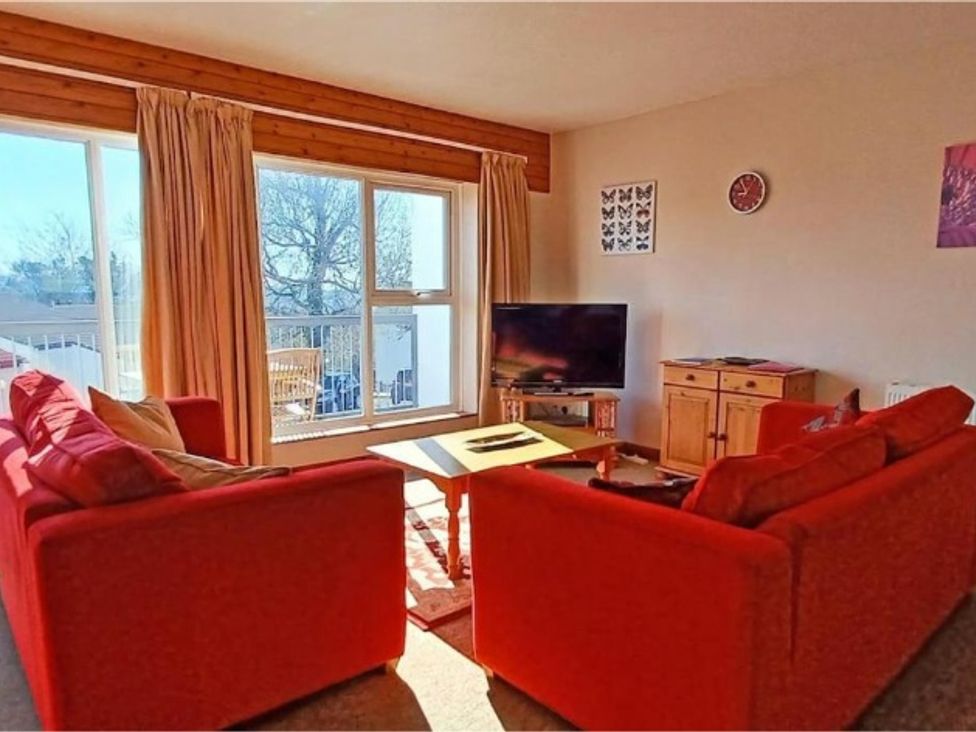 A living room with a television and a coffee table at the property