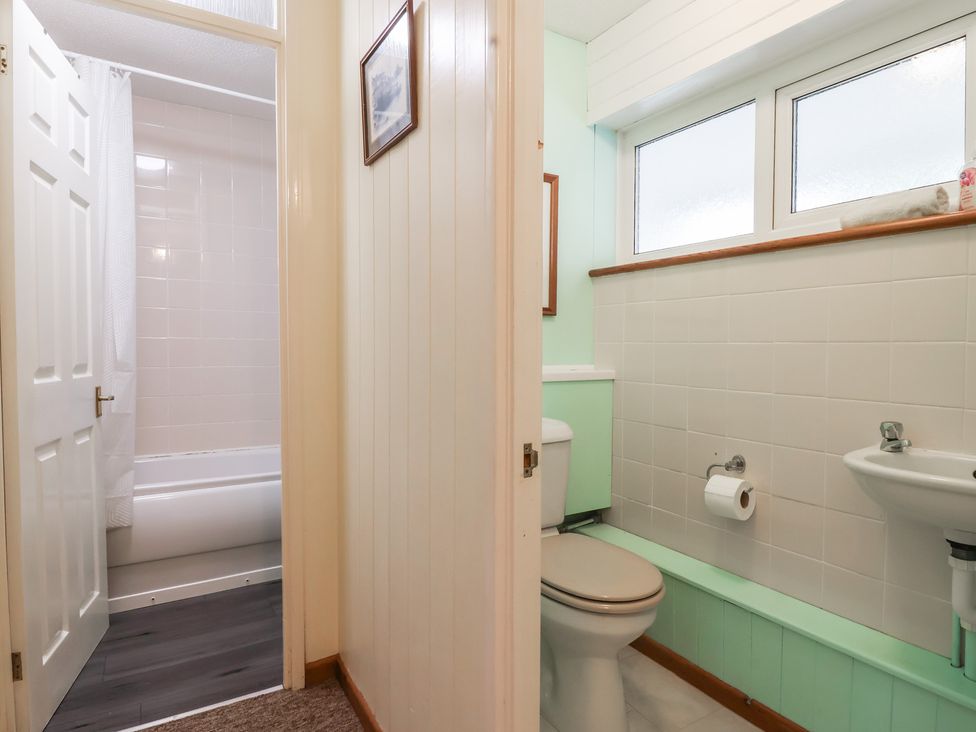A bathroom with a toilet and sink at 21 Tamar & St. Anns Cottages Honicombe Park near St. Ann's Chapel, Cornwall