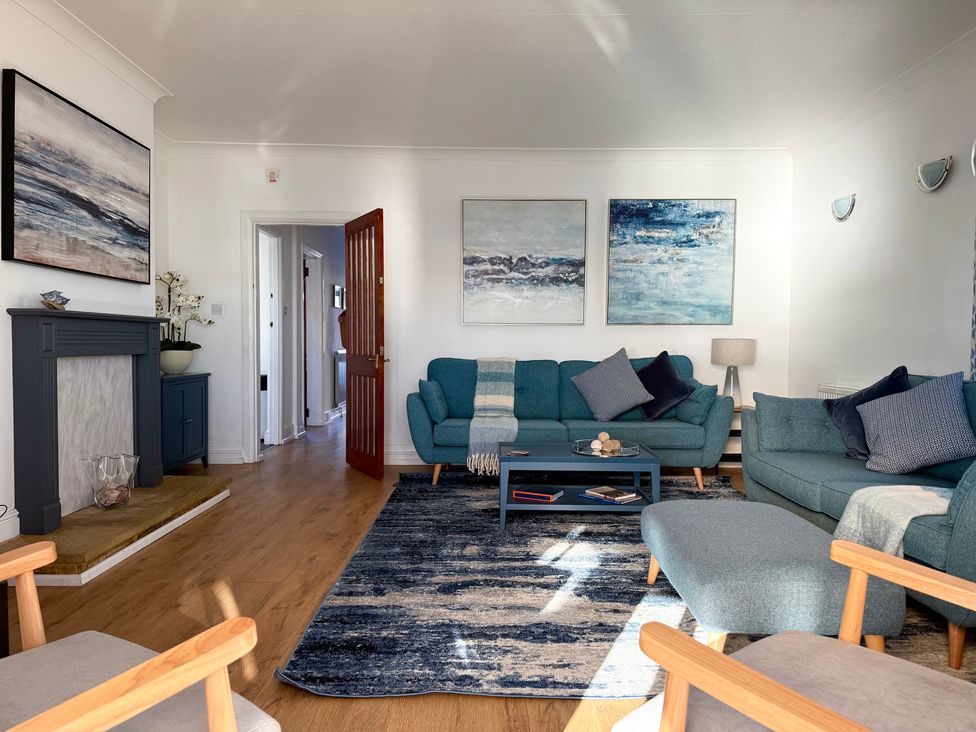 A living room with a sofa and coffee table at Crows Nest Dawlish