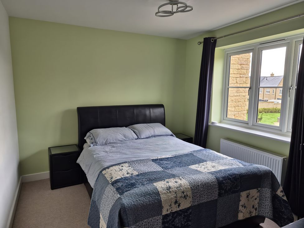 A bedroom with a bed and window at 54 swallow road