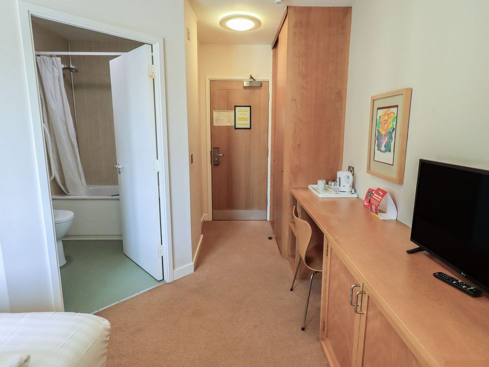 A bathroom with a shower and toilet at Thacka Beck Retreat at Eamont Park Penrith