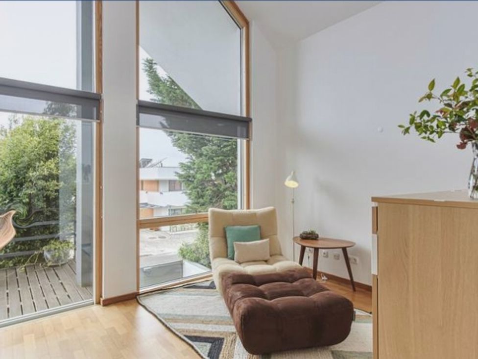 A snug with a chair and side table at the property in the location