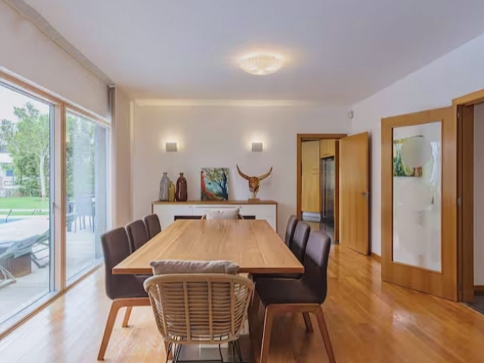 A dining room with a table and chairs at The Old Barn in Manchester