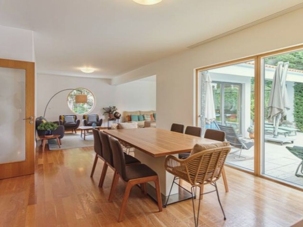 A dining room with a table and chairs at an unspecified location
