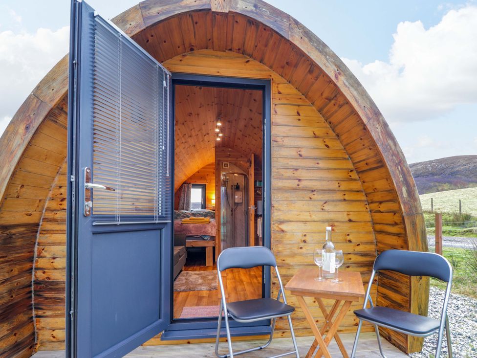 An entrance with chairs and a table at The Pod at Greenbank in Isle of Skye