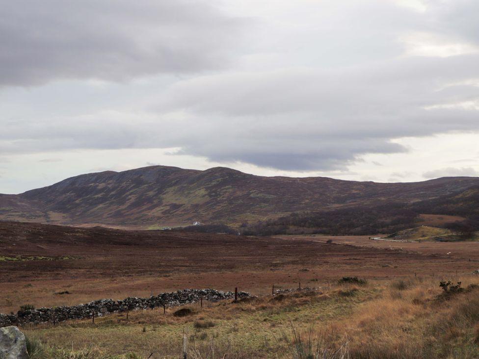 A landscape view of mountains and fields at The Pod at Greenbank Isle of Skye