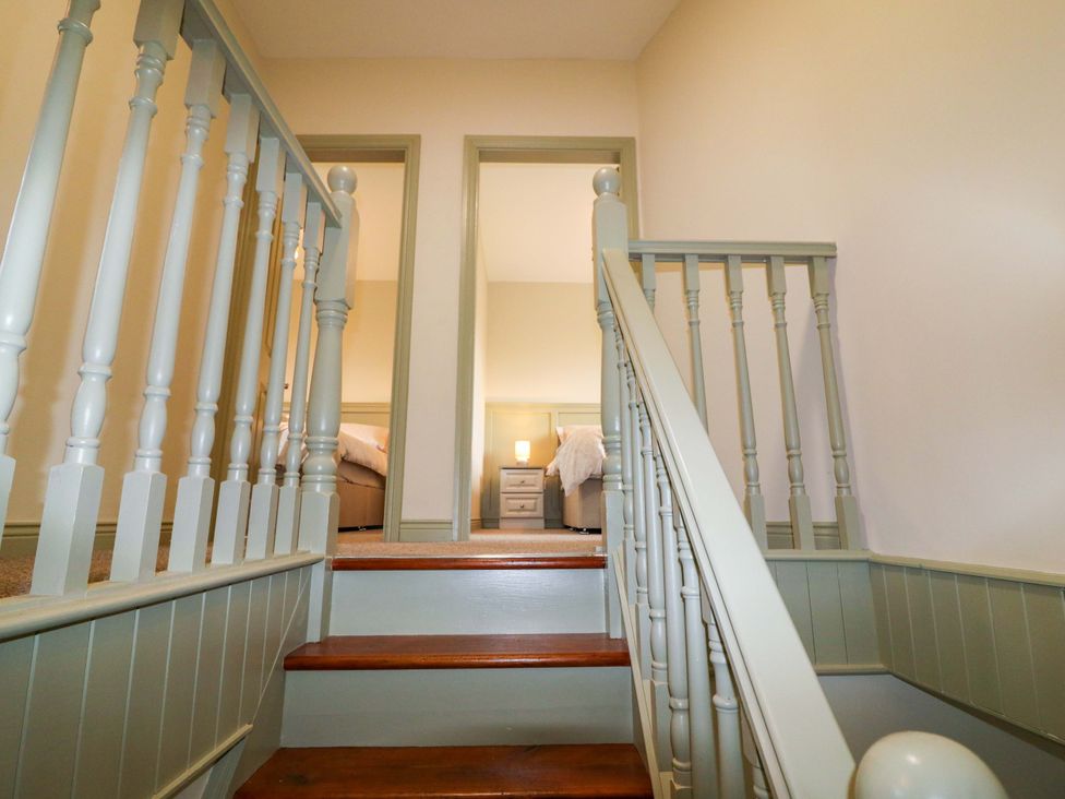 A staircase leading to bedrooms at Shamrock House