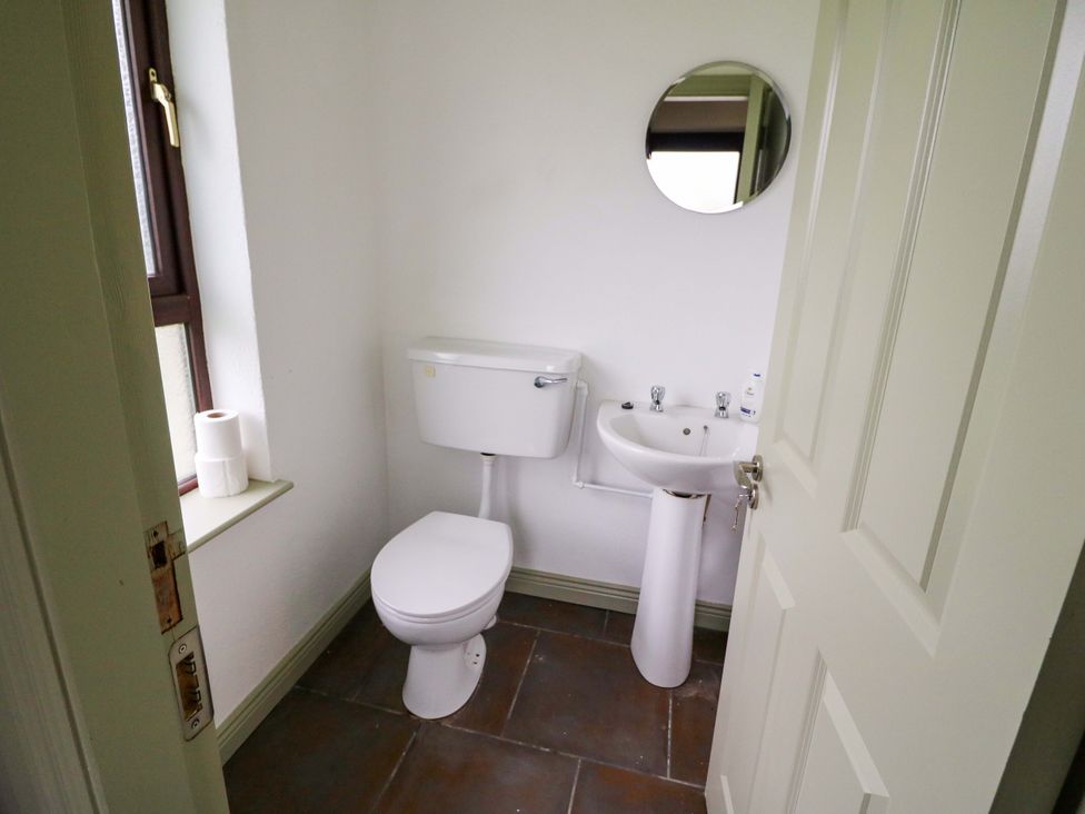A bathroom with a toilet and sink at Shamrock House