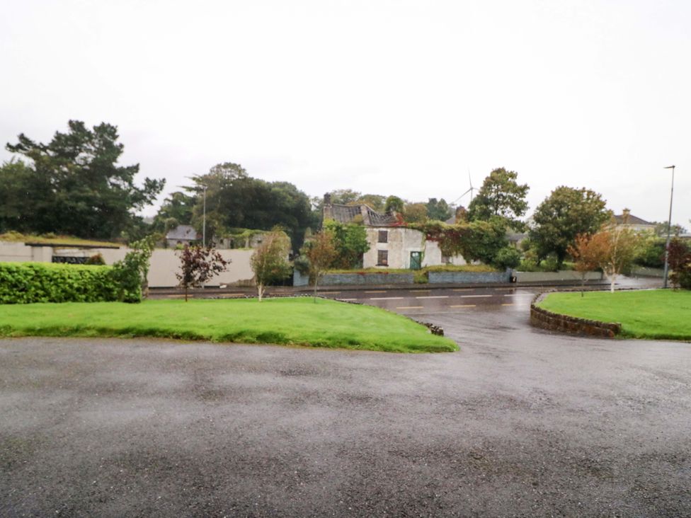 A view of a road with grass and trees at Shamrock House