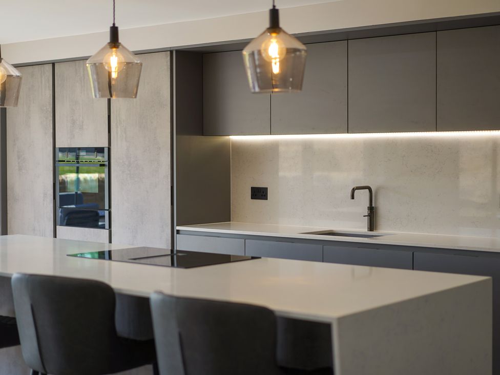 A kitchen with a sink and countertop at Northstone House Blackburn