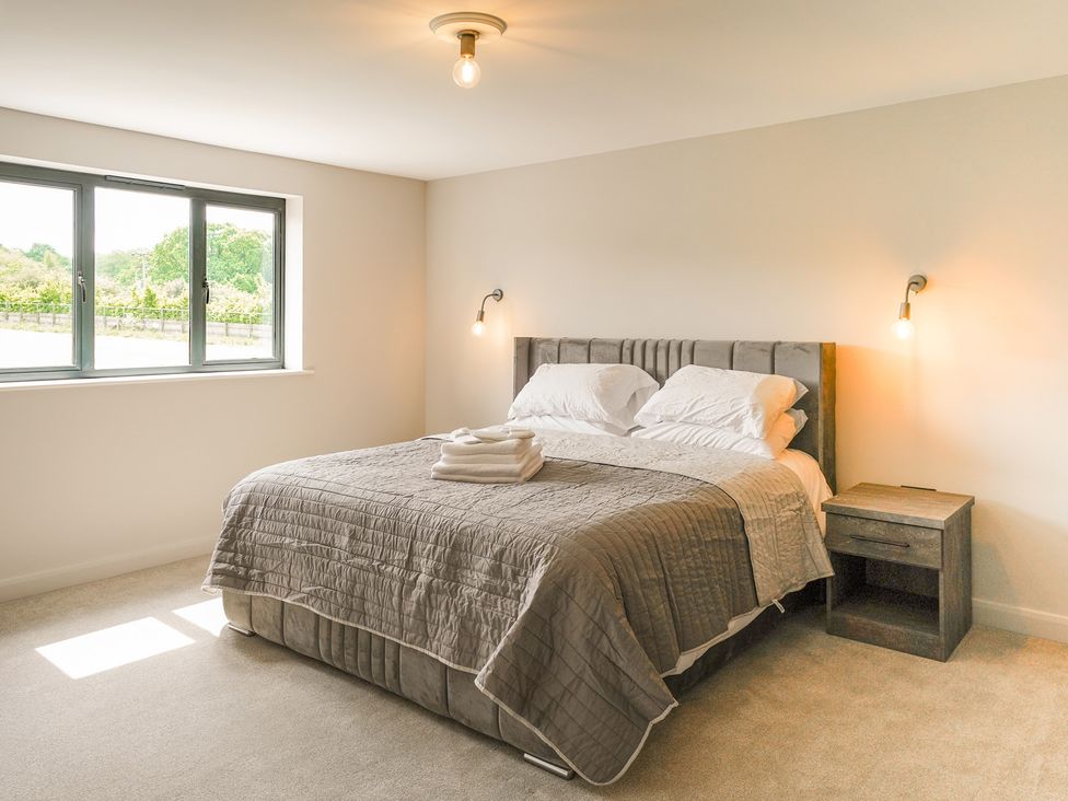 A bedroom with a bed and a window at Northstone House Blackburn