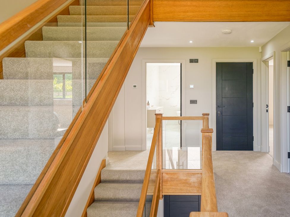 A staircase leading to rooms at Northstone House Blackburn