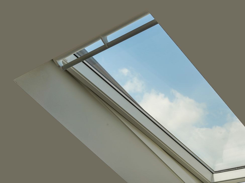 A skylight showing blue sky and clouds at Northstone House Blackburn