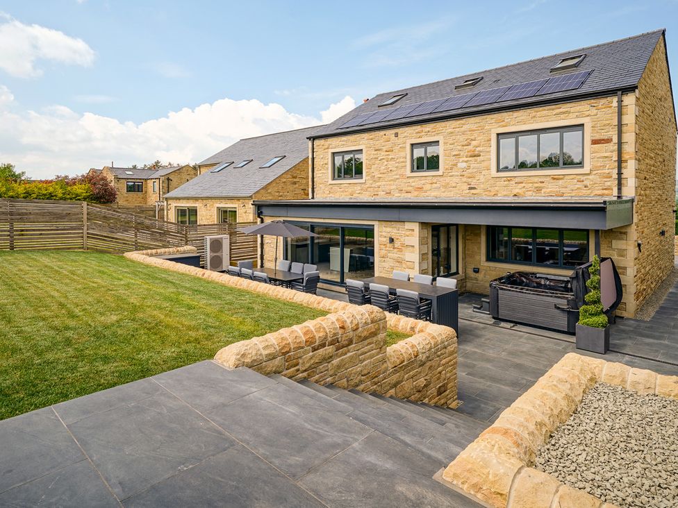 A house with a patio and garden at Northstone House Blackburn