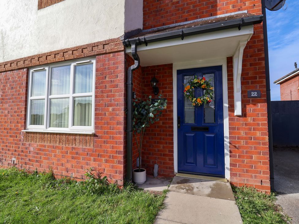 An entrance with a blue door and a wreath at The Beach Escape in Prestatyn