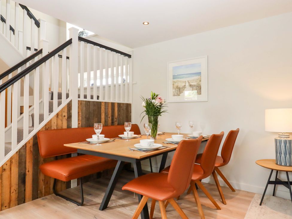 A dining room with a table and chairs at Duke's Barn Blackawton near Dartmouth