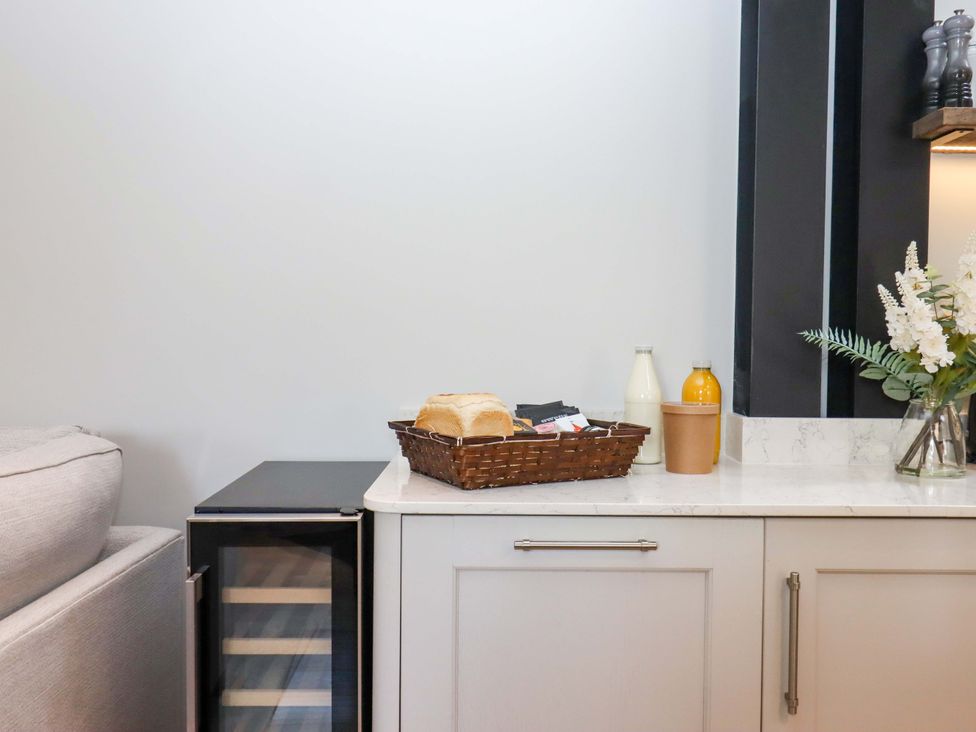 A kitchen counter with bread and drinks at Duke's Barn Blackawton near Dartmouth