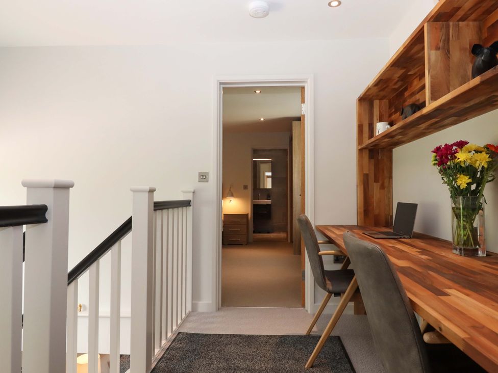 A hallway with a desk and chair at Duke's Barn in Blackawton near Dartmouth