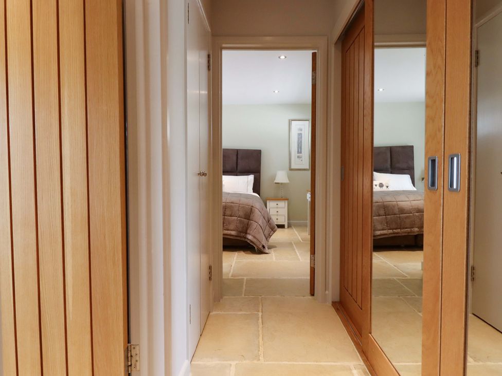 A bedroom with a bed and nightstand at Duke's Barn Blackawton near Dartmouth