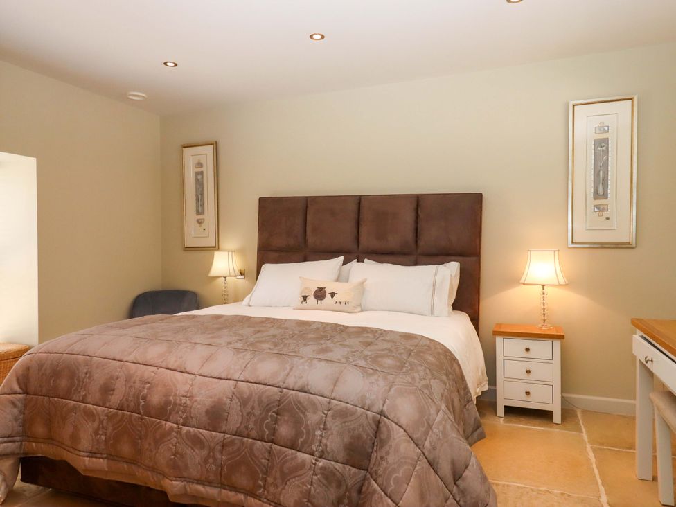 A bedroom with a bed and nightstand at Duke's Barn Blackawton near Dartmouth