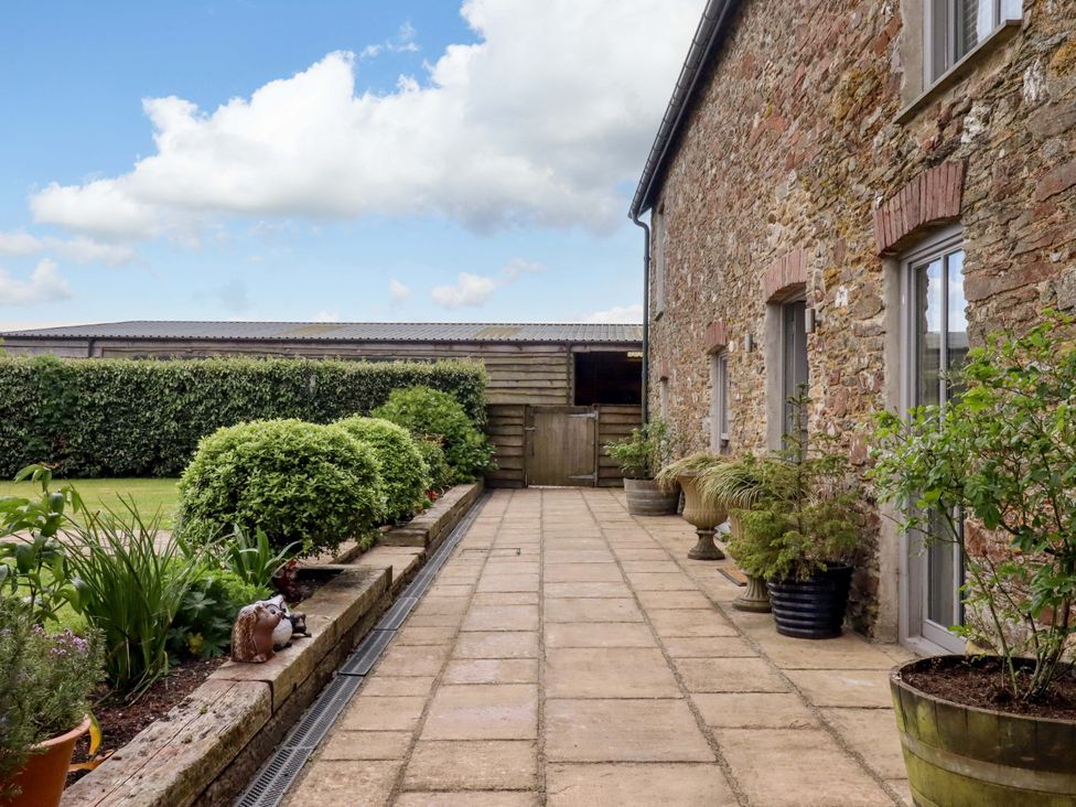 An outdoor area with paving stones and plants at Duke's Barn Blackawton near Dartmouth