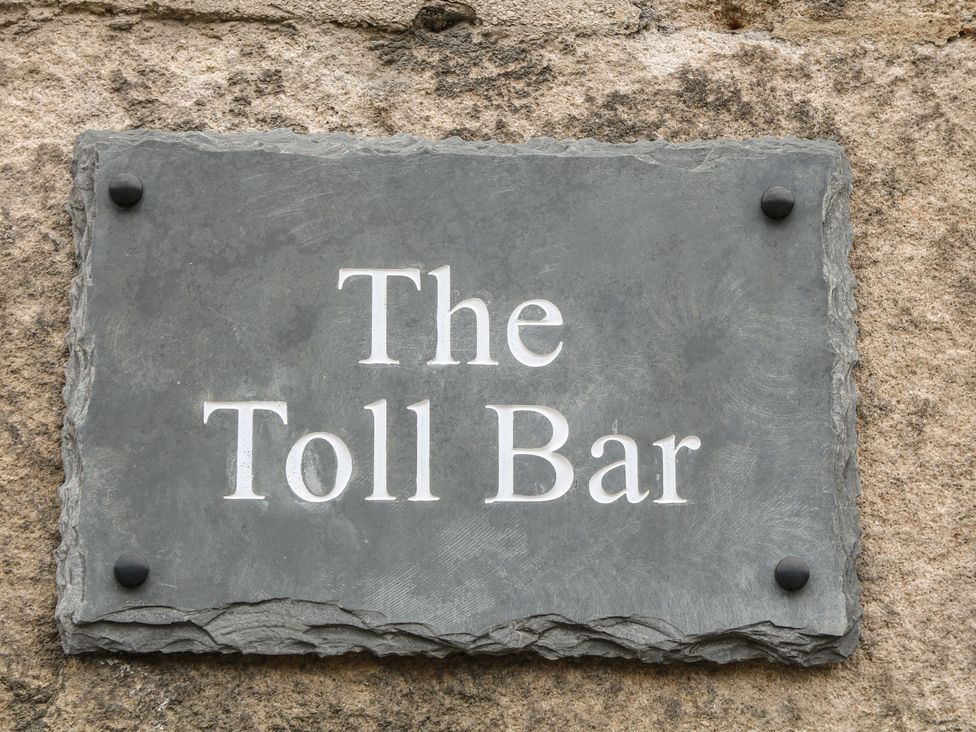 A sign reading The Toll Bar at The Toll Bar in Hope Valley