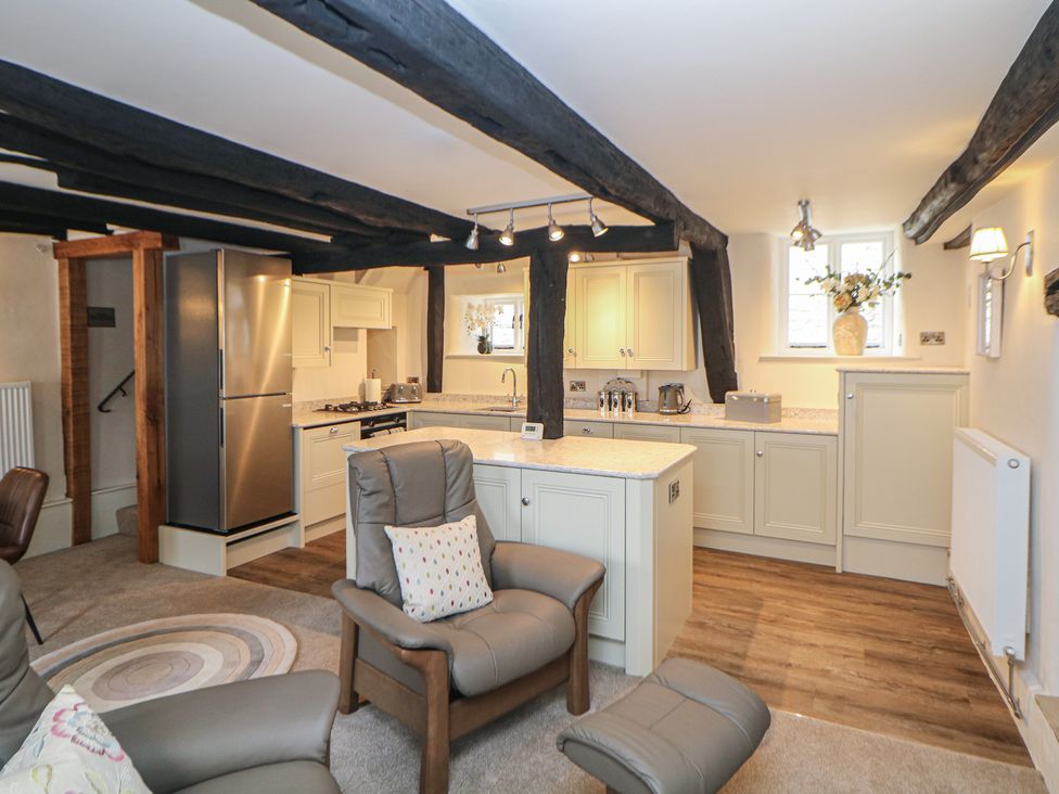 A kitchen with appliances and seating at The Toll Bar in Hope Valley