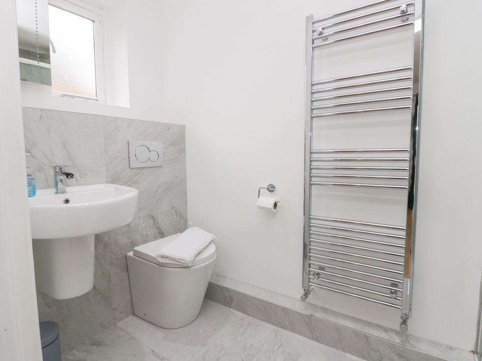 A bathroom with a sink and toilet at Catbells in Windermere