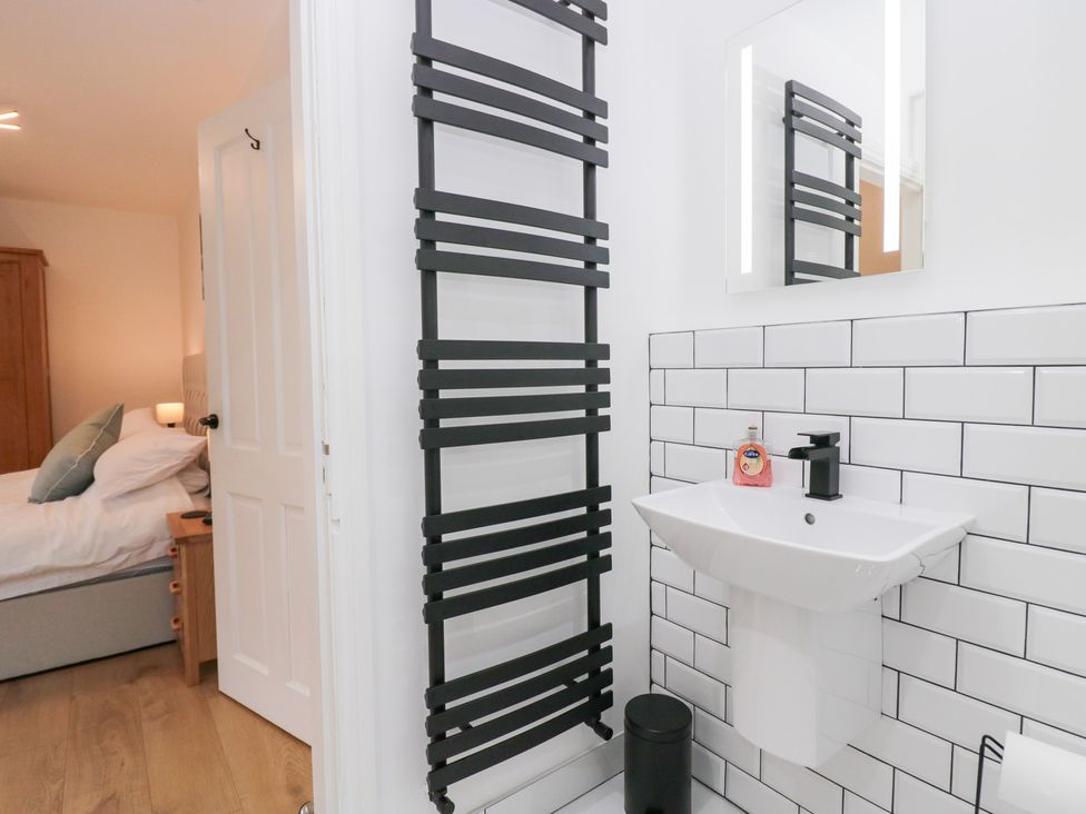 A bathroom with a sink and mirror at Catbells in Windermere