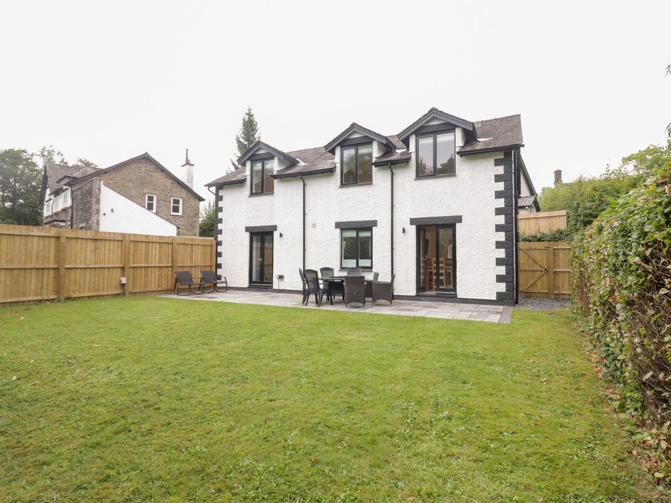 A house with patio and chairs in the garden at Catbells Windermere