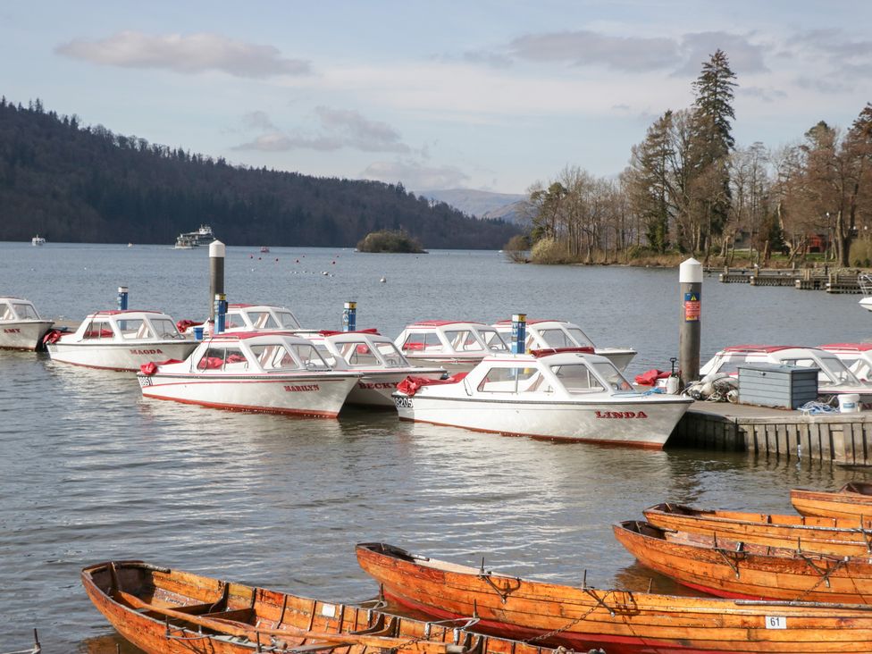A view of boats docked at a lake at Catbells in Windermere