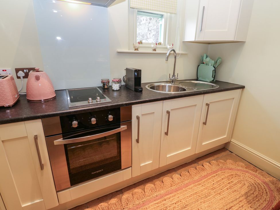 A kitchen with a sink and oven at The Annex