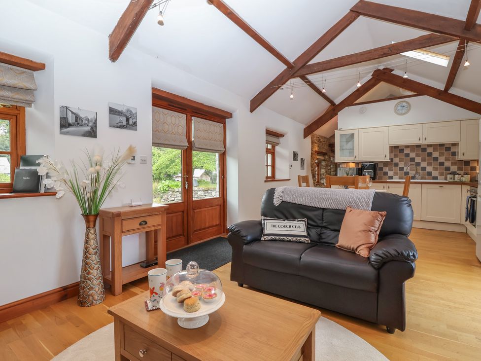 A living room with a sofa and coffee table at The Coach House in Tavistock