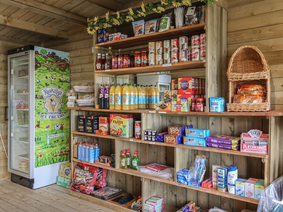A shop with shelves of snacks and beverages at The Coach House in Tavistock
