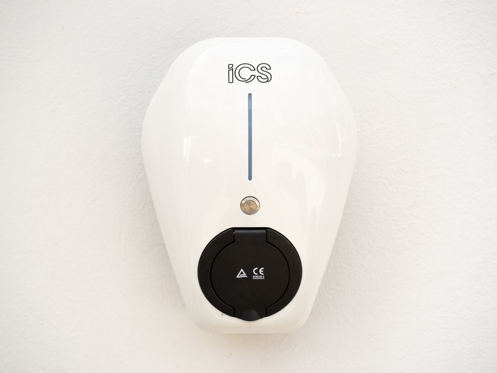 A charging station mounted on a wall at The Sundial in St Austell