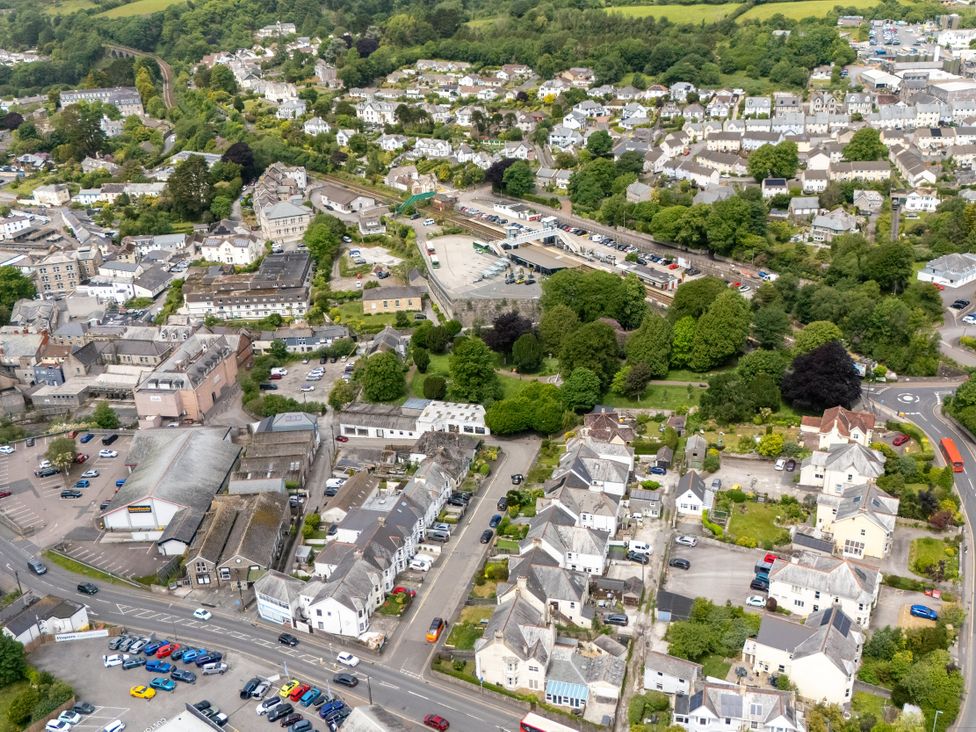 An aerial view of a town with houses and parking areas at The Sundial in St Austell