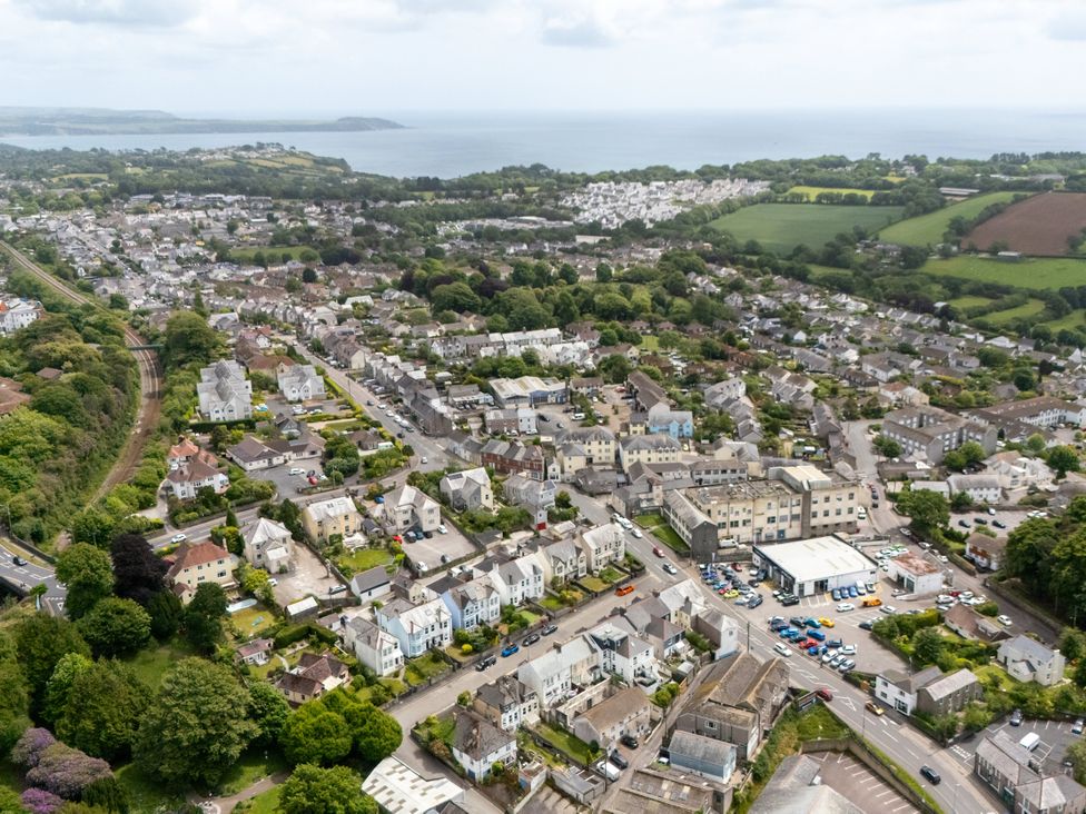 An aerial view of a residential area near the ocean at The Sundial in St Austell