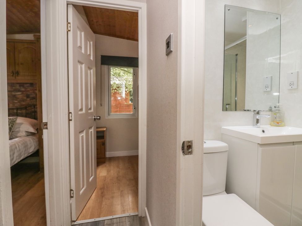 A bathroom with a sink and toilet at Owls Nook Lodge, Langdale 9, White Cross Bay near Windermere