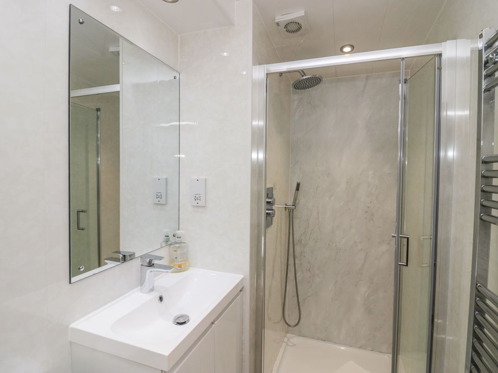A bathroom with a sink and shower at Owls Nook Lodge, Langdale 9, White Cross Bay near Windermere
