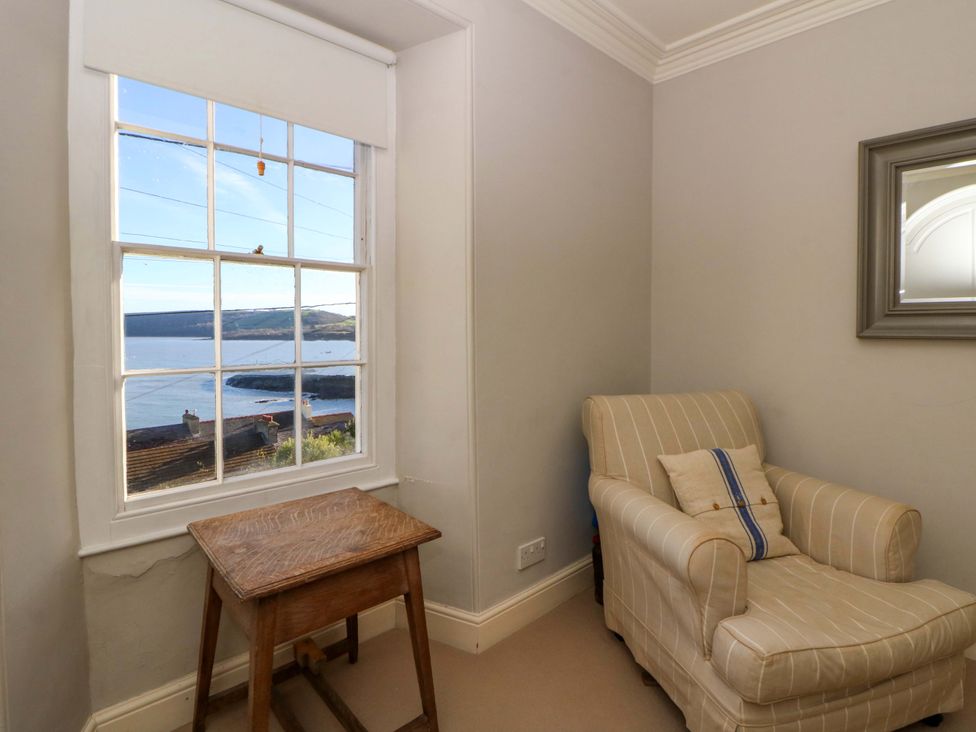 A sitting room with a view of the sea at Zenobia in New Quay