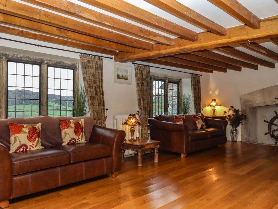 A living room with couches and lamps at Higher Wadden Farm in Southleigh