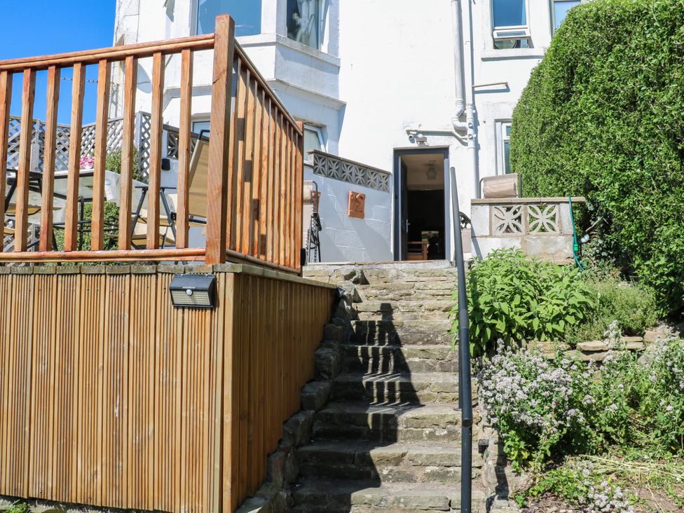 An outdoor area with stairs leading to a door at Ferncliffe