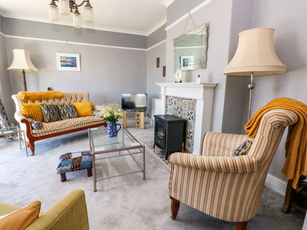 A living room with a sofa and coffee table at Ferncliffe