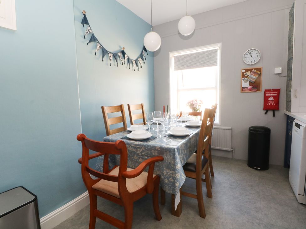 A dining room with a table set for meal at Ferncliffe