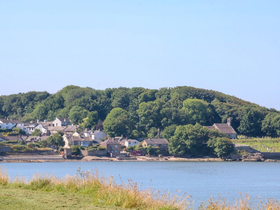 A view of houses and trees near water at Ferncliffe