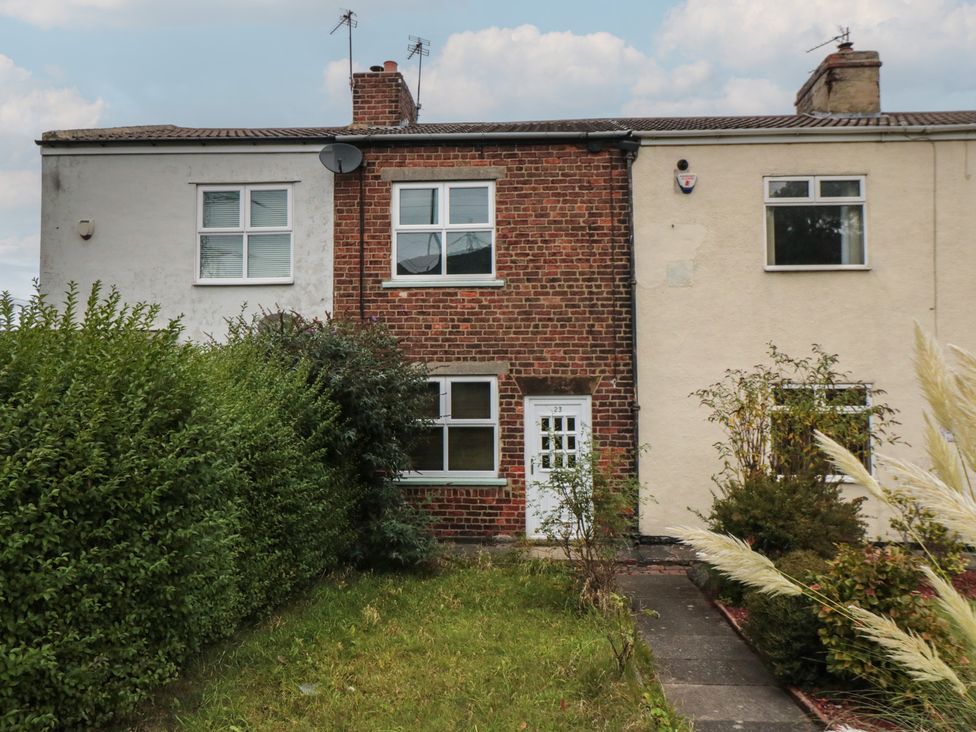 A house with a front garden and pathway at 23 South Lackenby